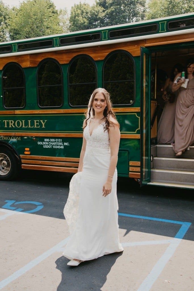 Bride posing beside the Golden Trolley