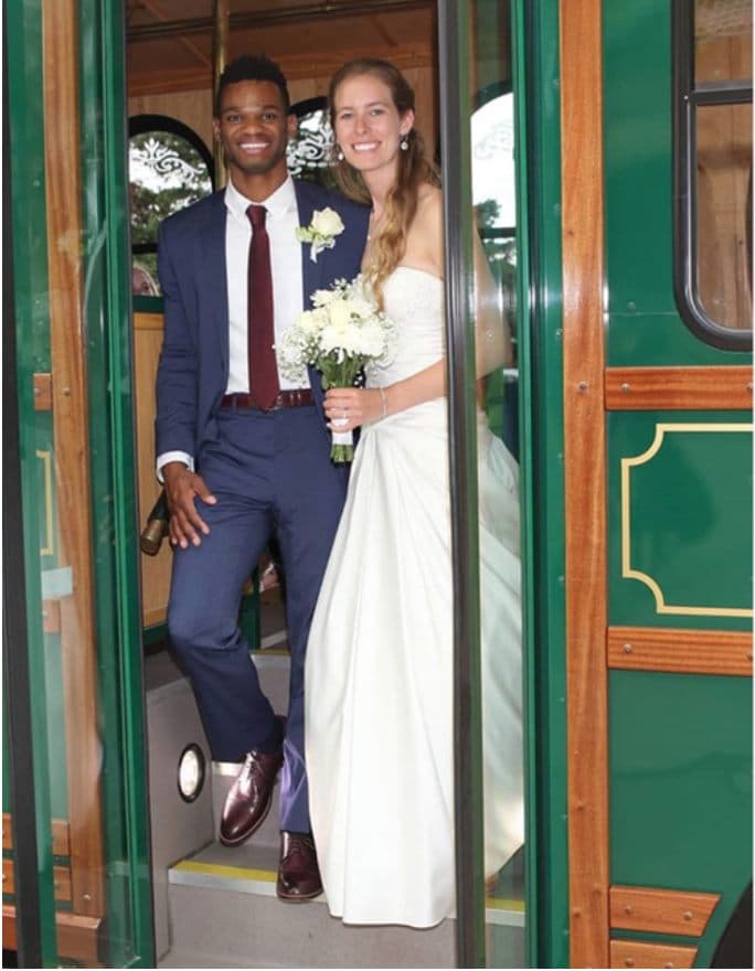 Bride and groom framed in the doorway of the trolley